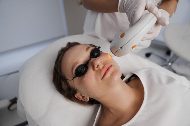 Phototherapy photorejuvenation ipl in a beauty salon care for a womans face high quality photo