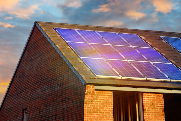 Photovoltaic solar panels on the roof of new house Roof with solar panels