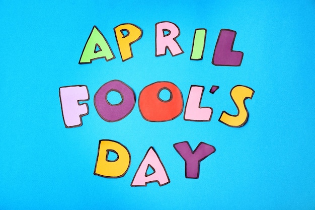 phrase april fool's day on color background