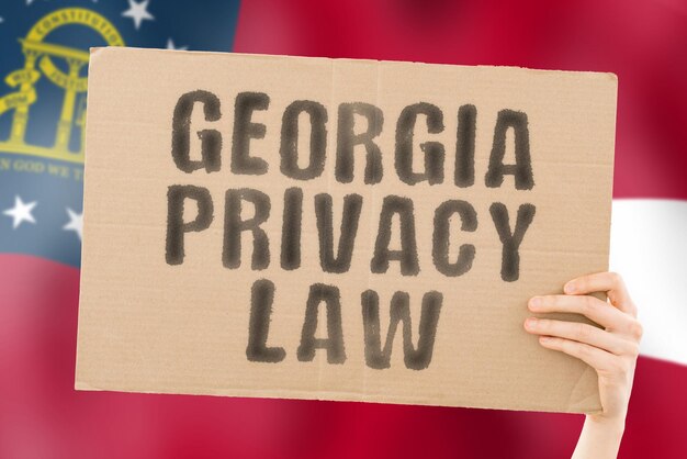 La frase legge sulla privacy della georgia su uno striscione in mano da uomo con la bandiera della georgia cliente privato