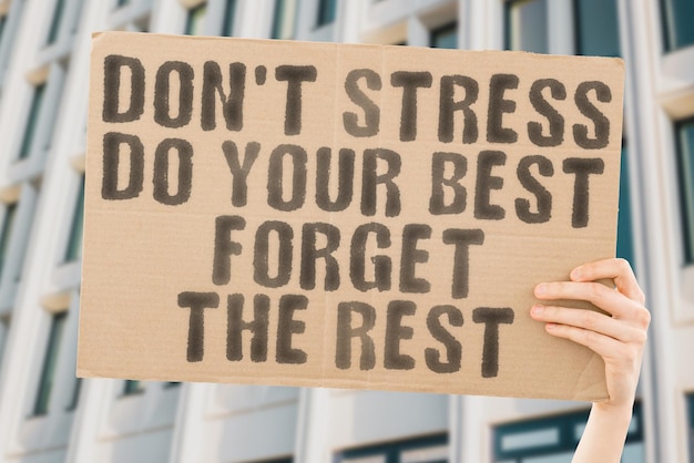 The phrase Do not stress do your best forget the rest on a banner in mens hand Grow Hurry