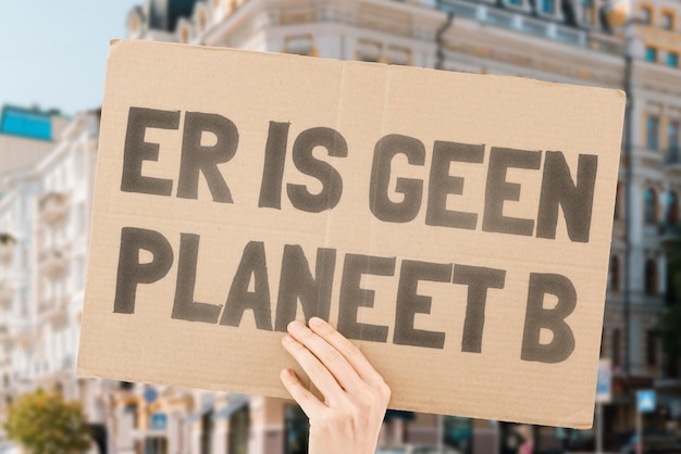 The phrase There is no planet B is drawn on a carton banner in men's hands Climate change Protest Global warming Zone Disaster Tension Poison Toxin Damage Impact Air