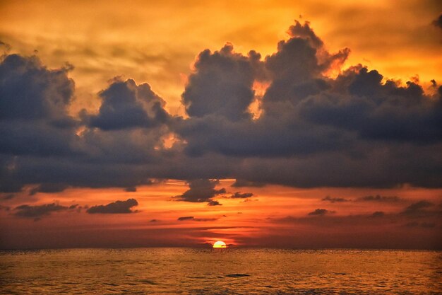 Phuket beach sunset colorful cloudy twilight sky reflecting on the sand indian ocean thailand asia