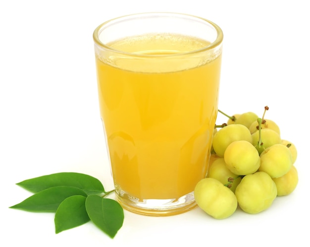 Phyllanthus acidus or Star gooseberry with juice in a glass