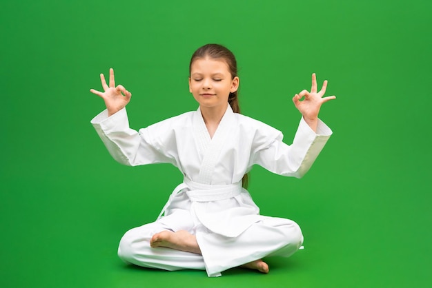 Physical preparation for karate competitions a girl in a white kimono children's sports development martial arts school for children