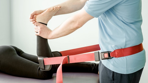 Physical therapy treatment using mulligan mobilisation belt, joint mobilisation and pain treatment