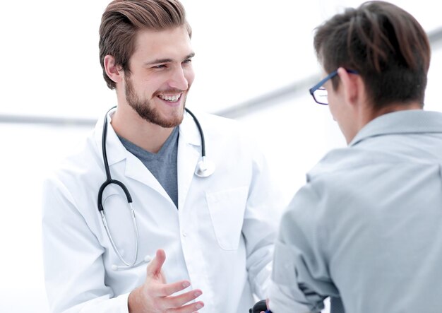 physician measuring blood pressure to make a diagnosis