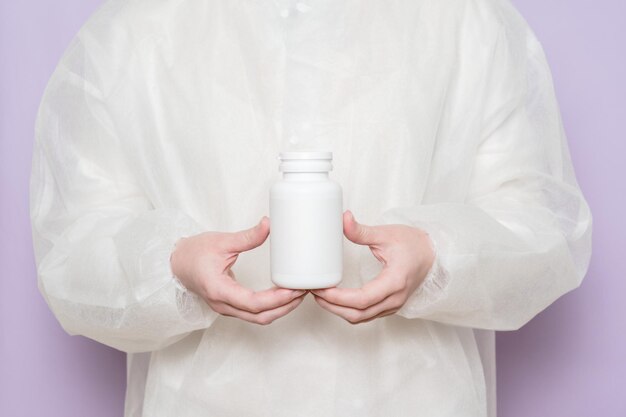 Physician medicine doctor holds a bottle for medicine supplement vitamins food supplement