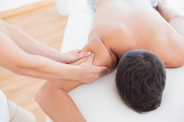 Physiotherapist doing arm massage to her patient