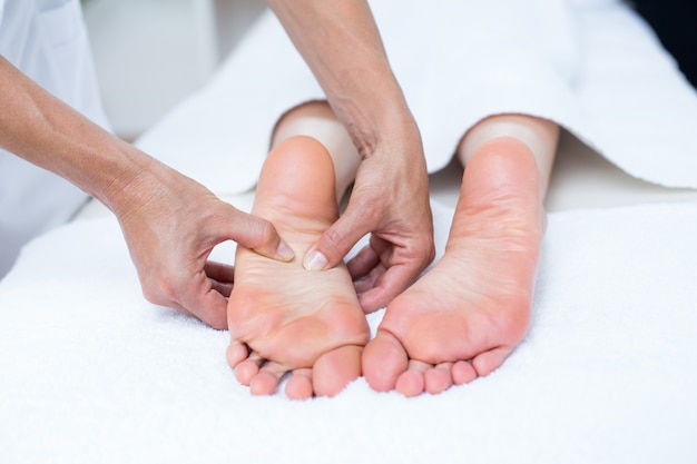 Physiotherapist doing foot massage