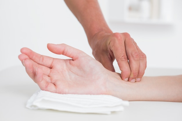 Physiotherapist doing hand massage 