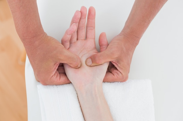 Physiotherapist doing hand massage 