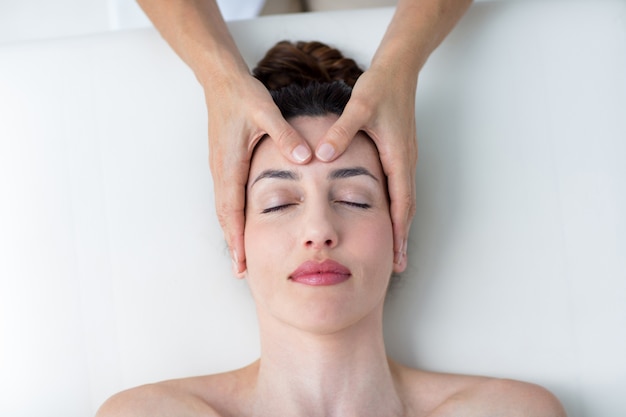 Physiotherapist doing head massage 