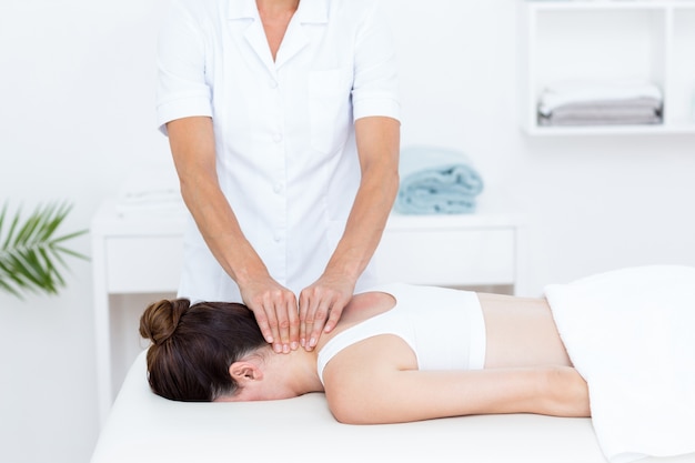 Physiotherapist doing neck massage 