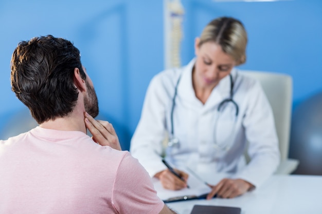 Physiotherapist interacting with patient