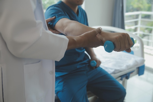 Physiotherapist working with patient in clinic closeup