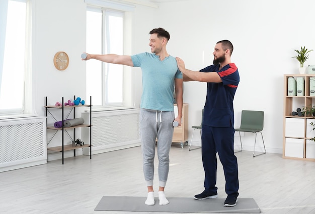 Physiotherapist working with patient in clinic Rehabilitation therapy