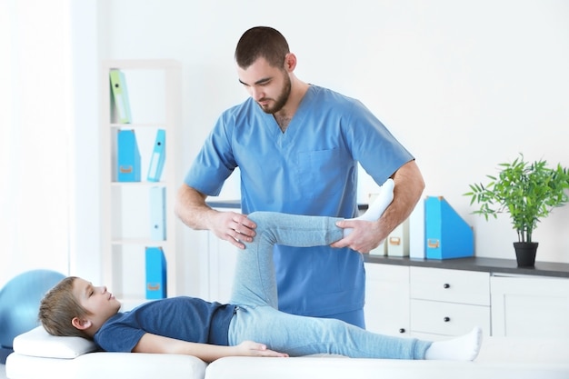 Physiotherapist working with patient in clinic