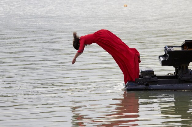 Pianist playing the piano at the lake