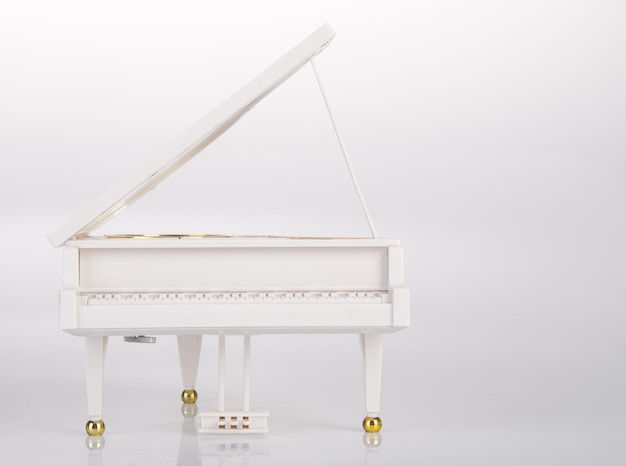 Piano against white background