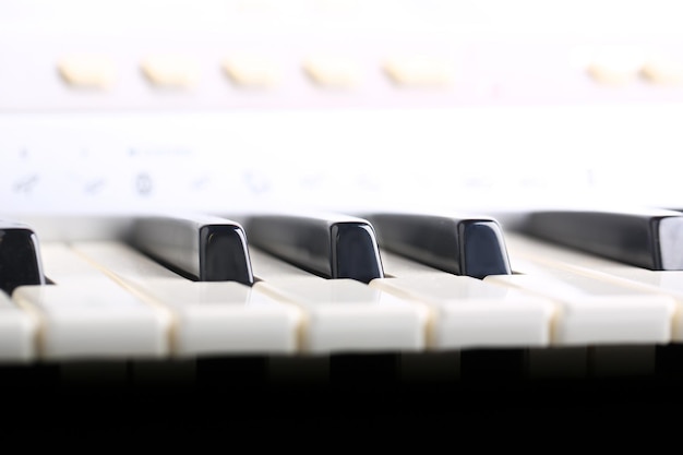 Photo piano keyboard in a gentle air of retro style musical background selective soft focus