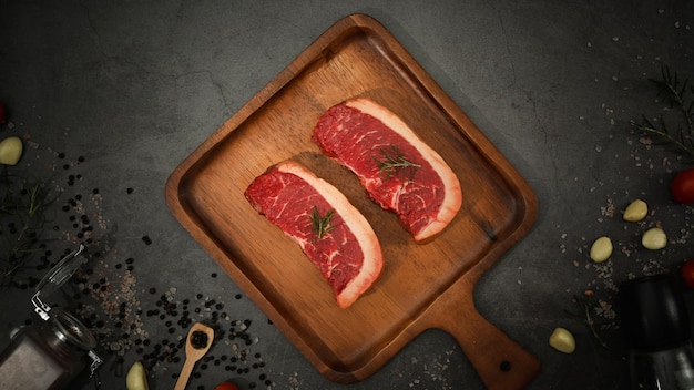 Picanha raw beef steak on wooden cutting board