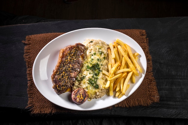 Picanha steak traditional brazilian beef cut with chimmy churry and risoto.