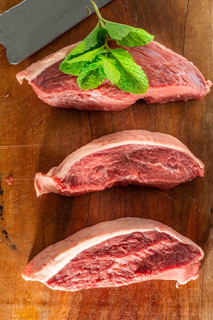 Picanha steaks on cutting board top view