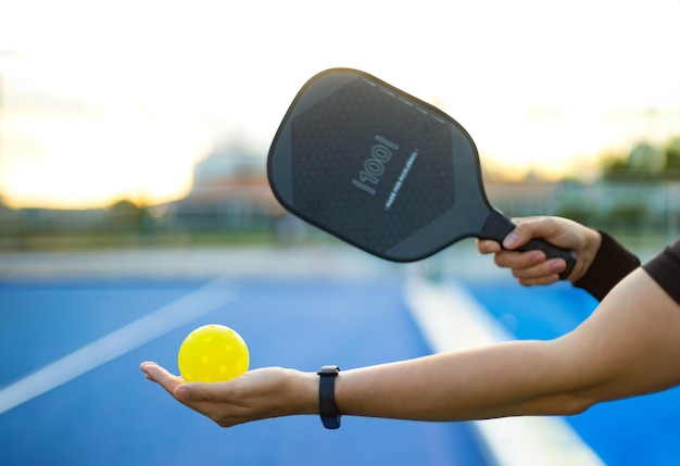 Pickleball tennis racket background with copy space sport court and ball