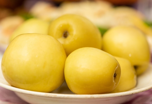 Pickled apples in a white plate.