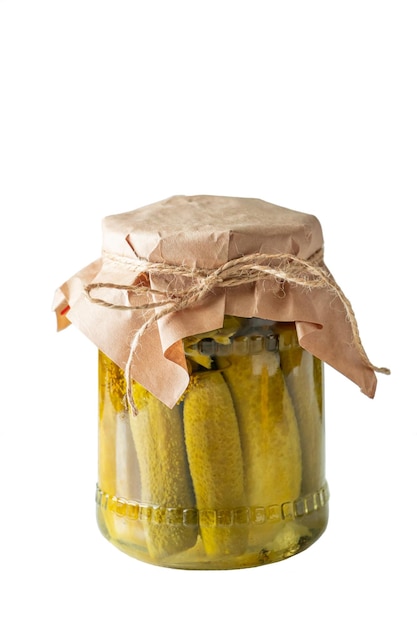 Pickled cucumbers in glass jar isolated on white background Homemade vegan preserves Fermented trending food