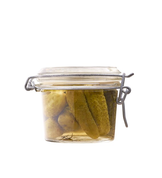 Pickled cucumbers in a glass jar isolated on white