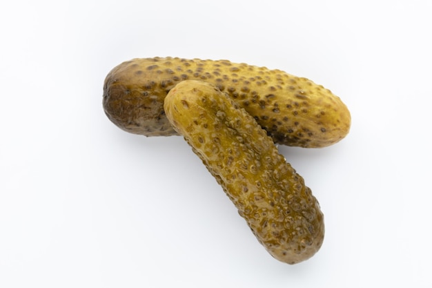 Pickled cucumbers isolated on white.