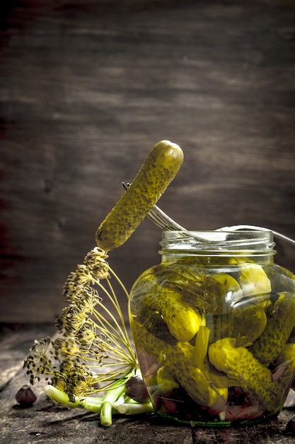 Photo pickled cucumbers with herbs and spices.