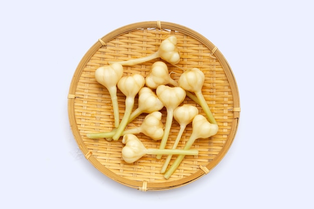 Pickled garlic in round on white background.