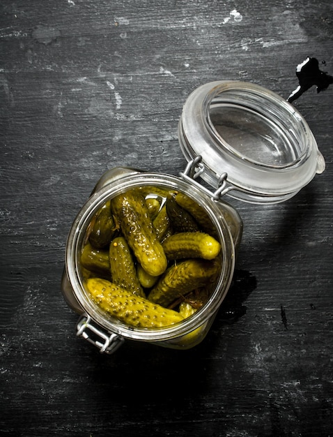 Pickled gherkins in a jar.