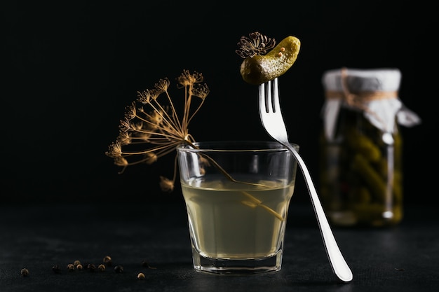 Pickled juice, pickle and marinated cucumber in a glass jar