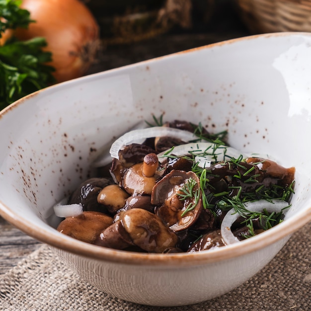 Pickled  mushrooms with onion in a bowl