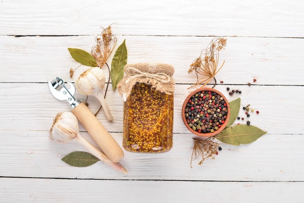 Pickled mustard in a jar Stocks of food Top view On a wooden background Copy space