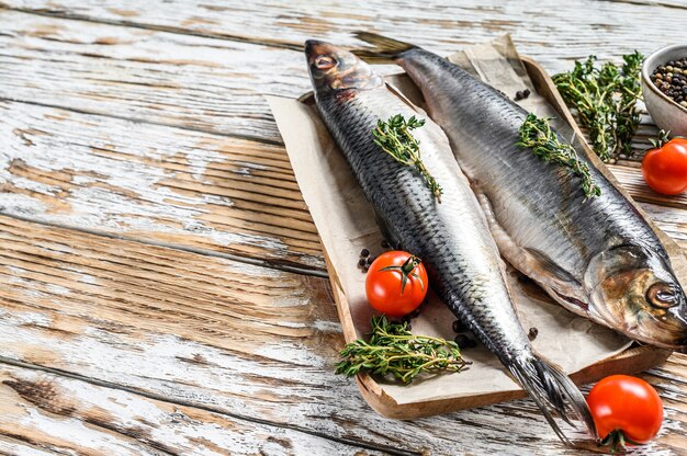 Pickled Nordic herring in a wooden bowl