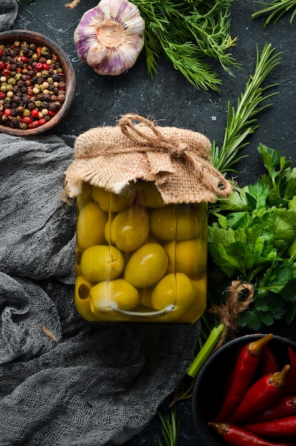 Pickled olives in a glass jar Food stocks Top view