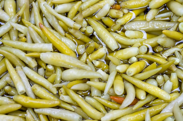 Pickled peppers close up Pickled peppers as background texture