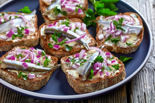 Pickled sprat rye bread open sandwiches top view