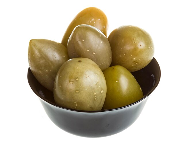 Pickled tomatoes isolated on the white background