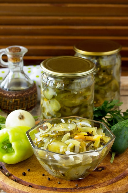 Pickles in jars on a wooden board