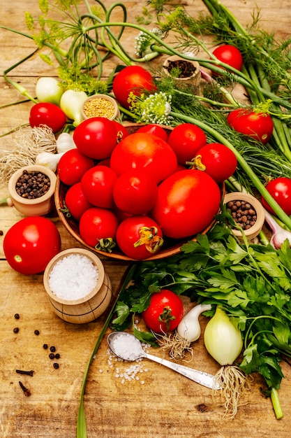 Pickling vegetables concept. Cooking process, spices, fresh fragrant herbs