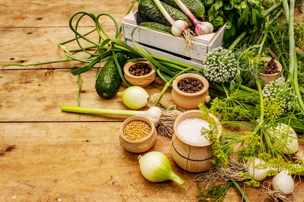 Pickling vegetables concept. Cooking process, spices, fresh fragrant herbs