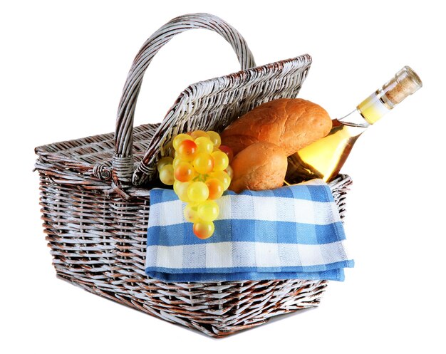 Picnic basket with grape and bottle of wine isolated on white