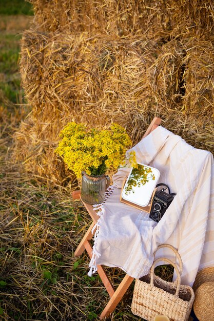 Picnic in the field near straw bales