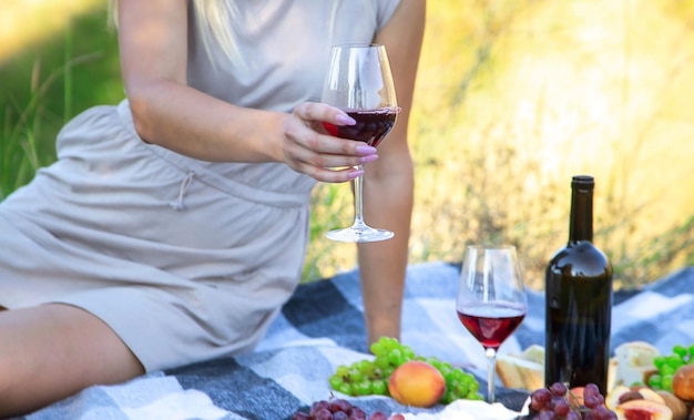 Picnic in nature girl pouring wine couple in love nature